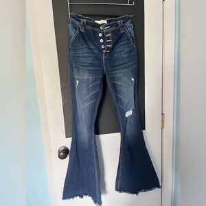 High rise dark wash flared distressed jeans
